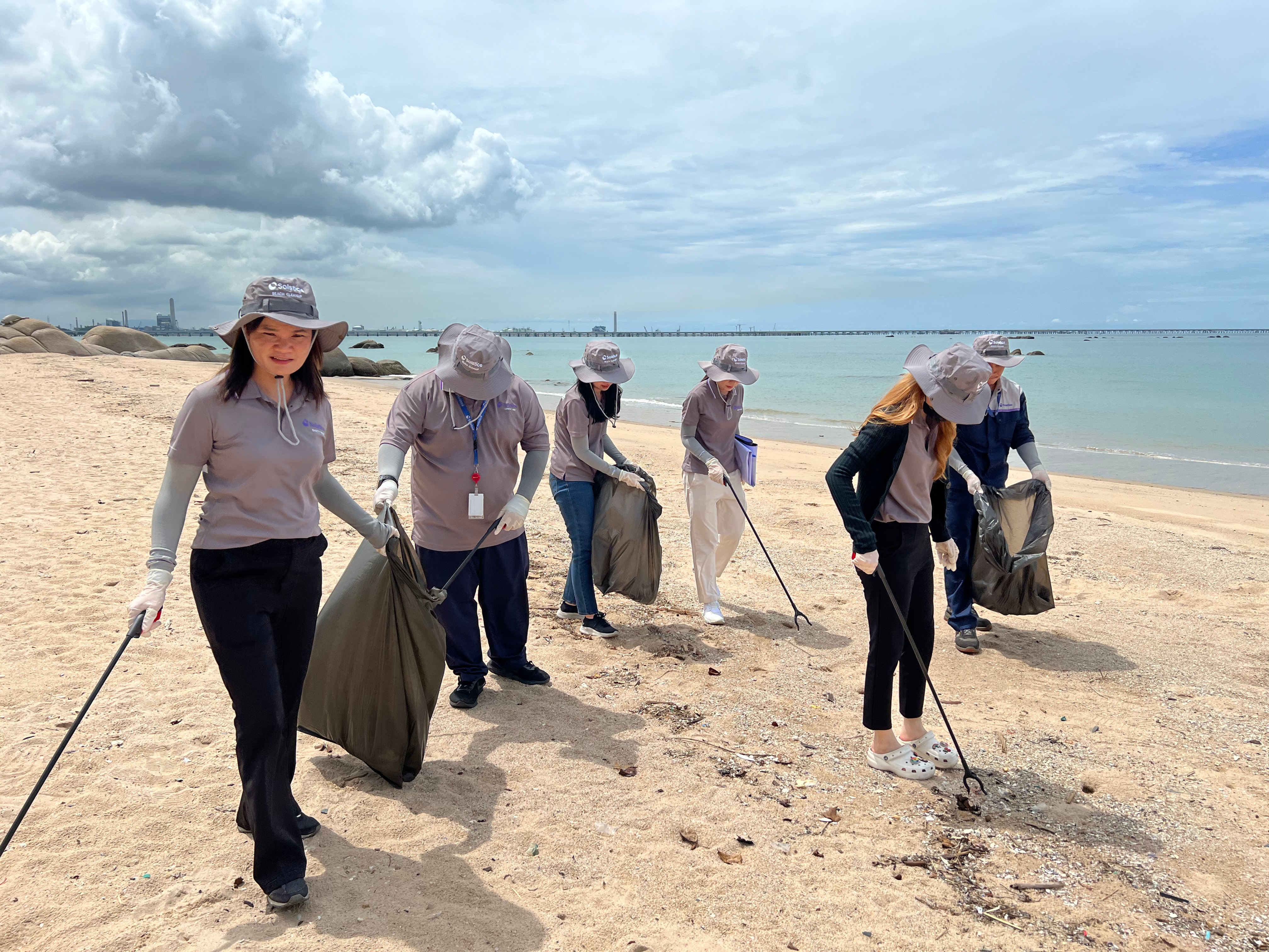 Solstice Advanced Materials employees in Chonburi, Thailand, gather for a beach cleaning activity.